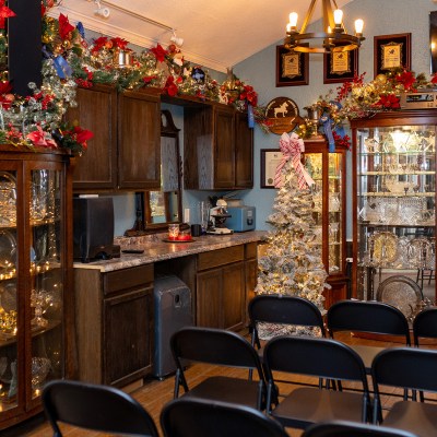 a room filled with furniture and a fire place sitting in a chair